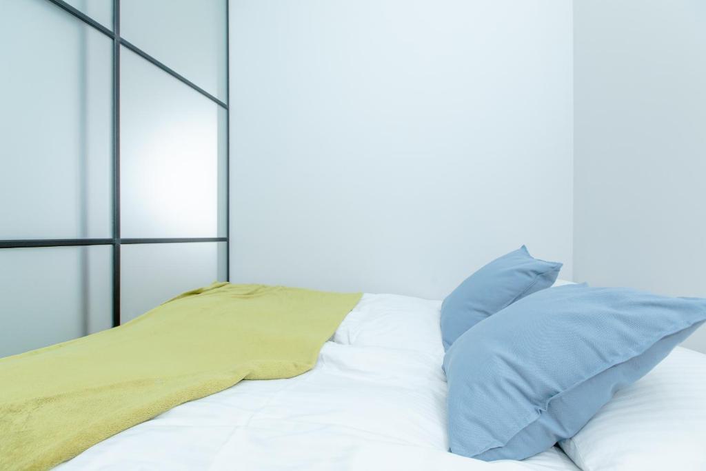 Postel nebo postele na pokoji v ubytování Resort Apartamenty Klifowa Rewal 59