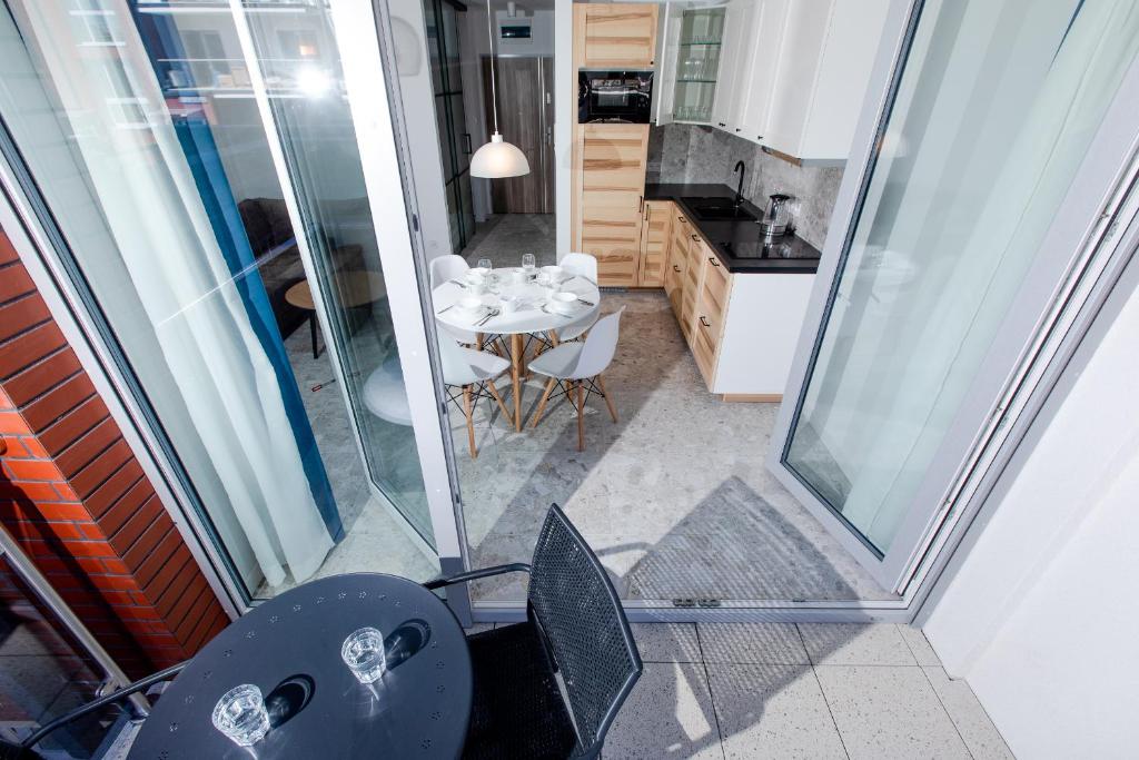 Kuchyň nebo kuchyňský kout v ubytování Resort Apartamenty Klifowa Rewal 59