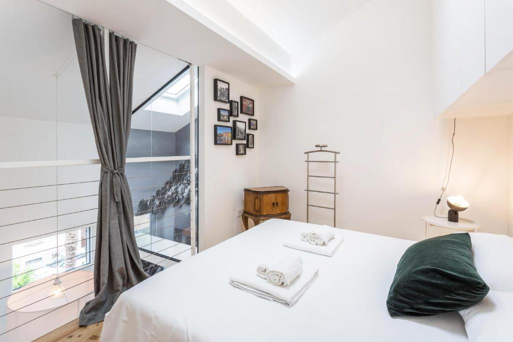 Łóżko lub łóżka w pokoju w obiekcie Mandello amorevole dimora in Lecco