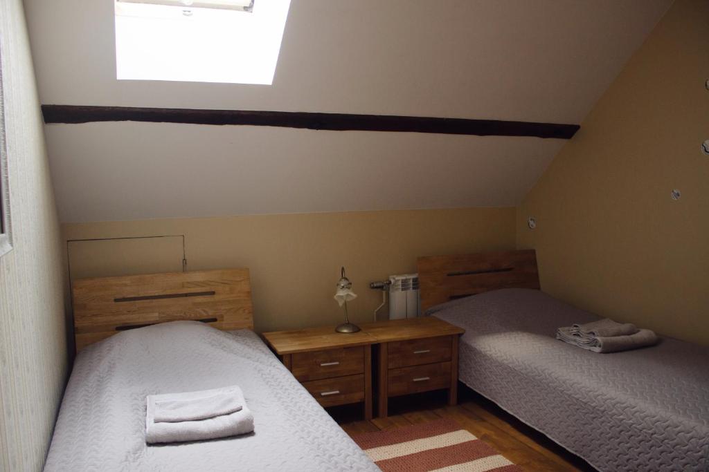 Postel nebo postele na pokoji v ubytování Mõisa Ait Katusekorter