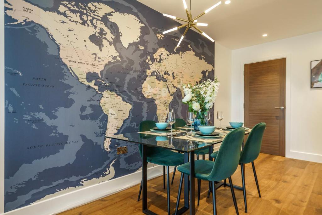 a world map mural on a wall in a dining room at City Pad @ Ryedale House in York