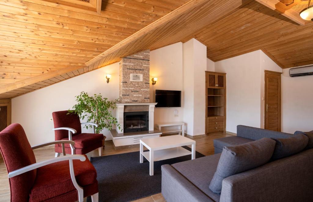 TV a/nebo společenská místnost v ubytování XOX Apart Hotel