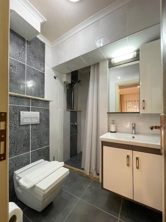 Koupelna v ubytování XOX Apart Hotel