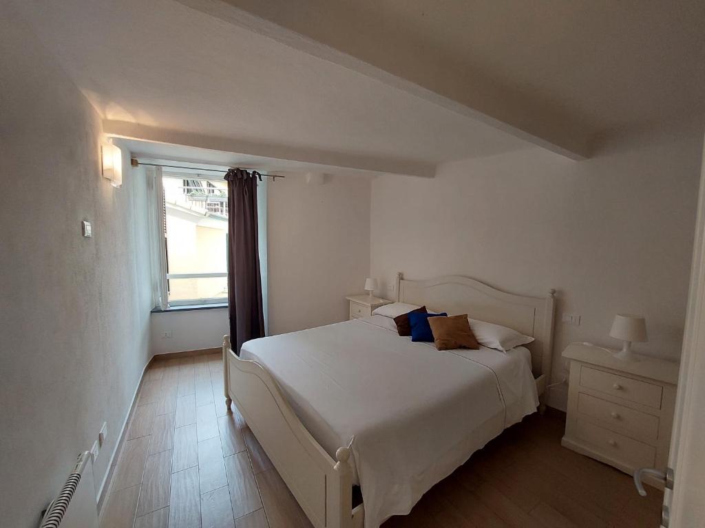 Postel nebo postele na pokoji v ubytování Mariasole Rooms