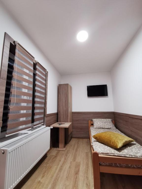 Postel nebo postele na pokoji v ubytování Vila Zlatarka