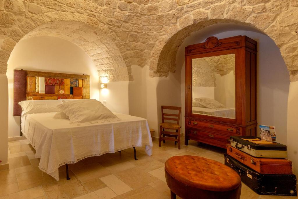Posteľ alebo postele v izbe v ubytovaní Navolte Trulli e Quiete con Piscina