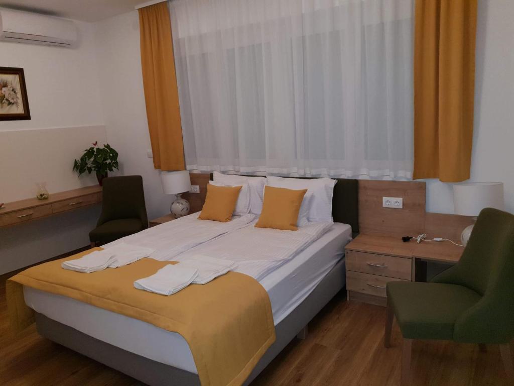 Postel nebo postele na pokoji v ubytování Villa Heuréka