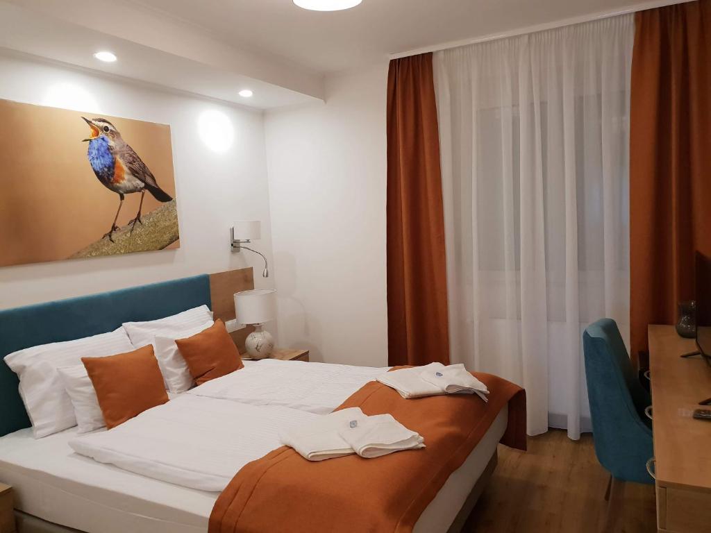 Postel nebo postele na pokoji v ubytování Villa Heuréka