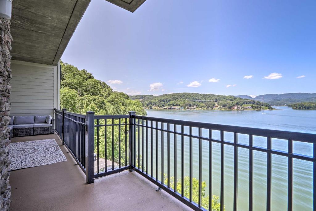 a balcony with a view of the water at Waterfront Bean Station Condo with Balcony and Views! in Bean Station