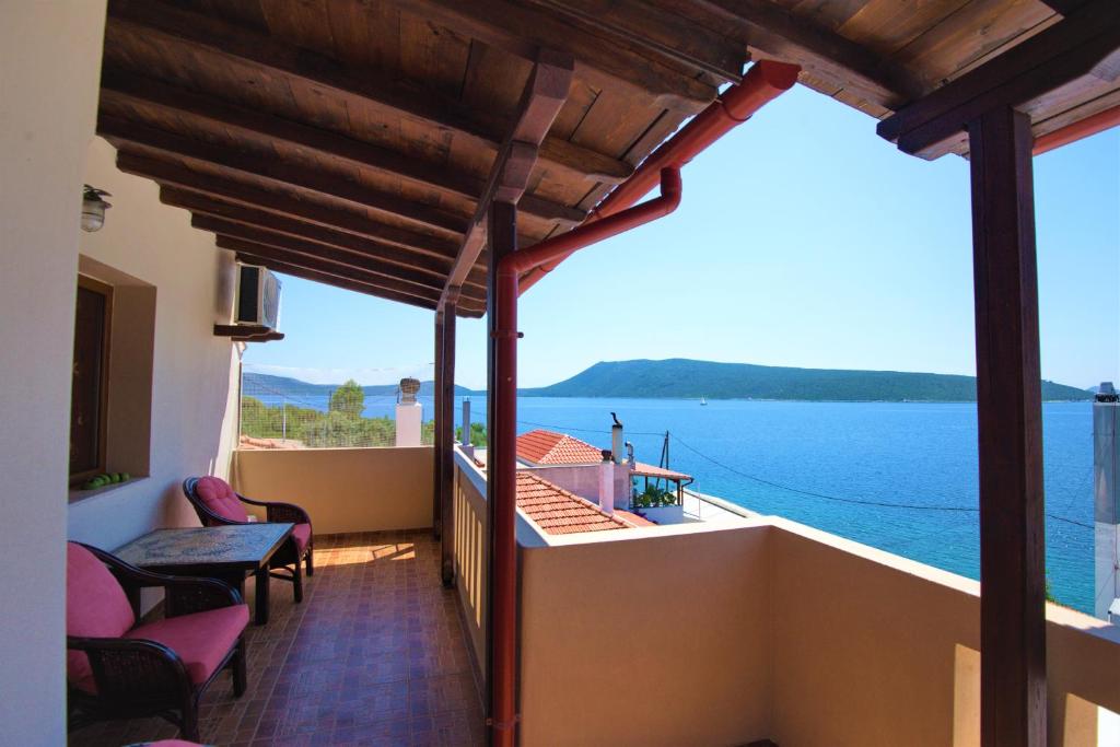 a balcony with a view of the water at Sossinola in Steni Vala Alonissos