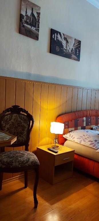 Postel nebo postele na pokoji v ubytování Penzion TOMINO