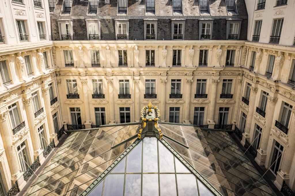 a building with a glass floor in front of it at InterContinental Paris Le Grand by IHG in Paris