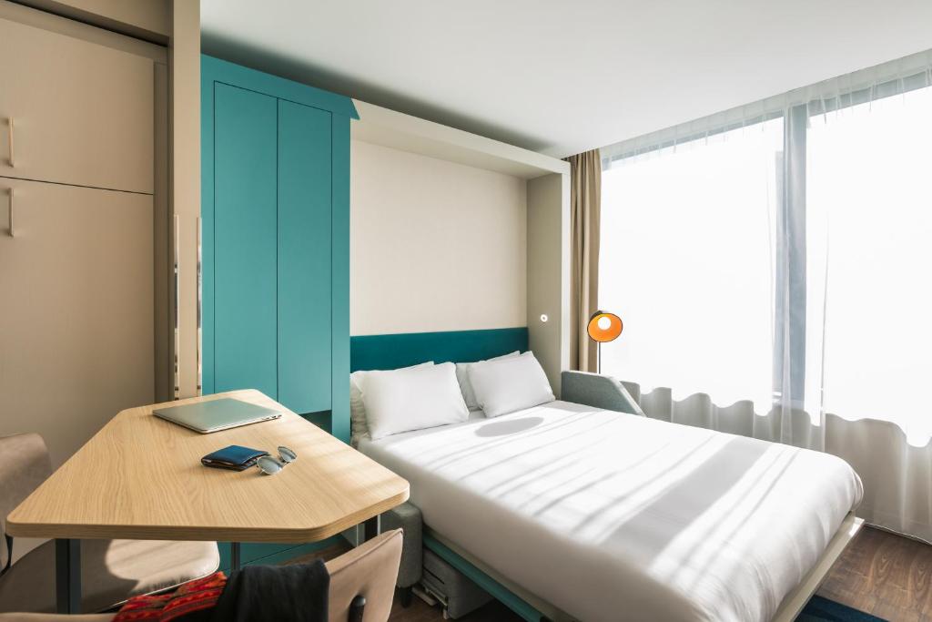 Postel nebo postele na pokoji v ubytování Aparthotel Adagio London Stratford