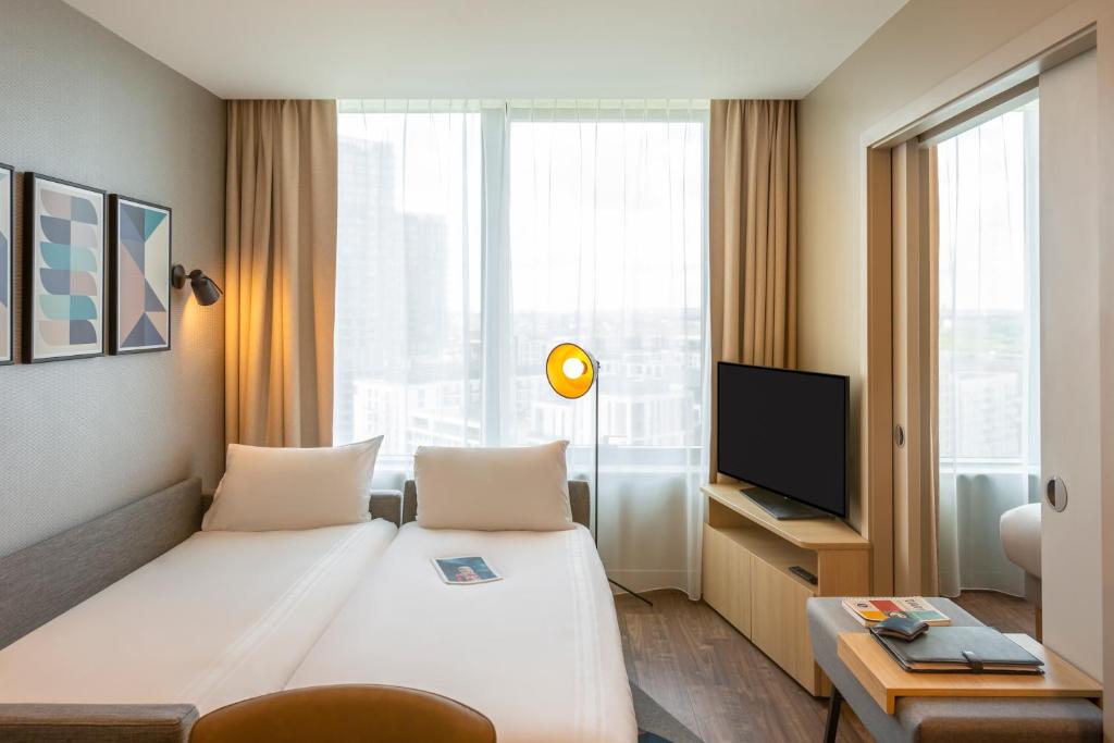 TV a/nebo společenská místnost v ubytování Aparthotel Adagio London Stratford