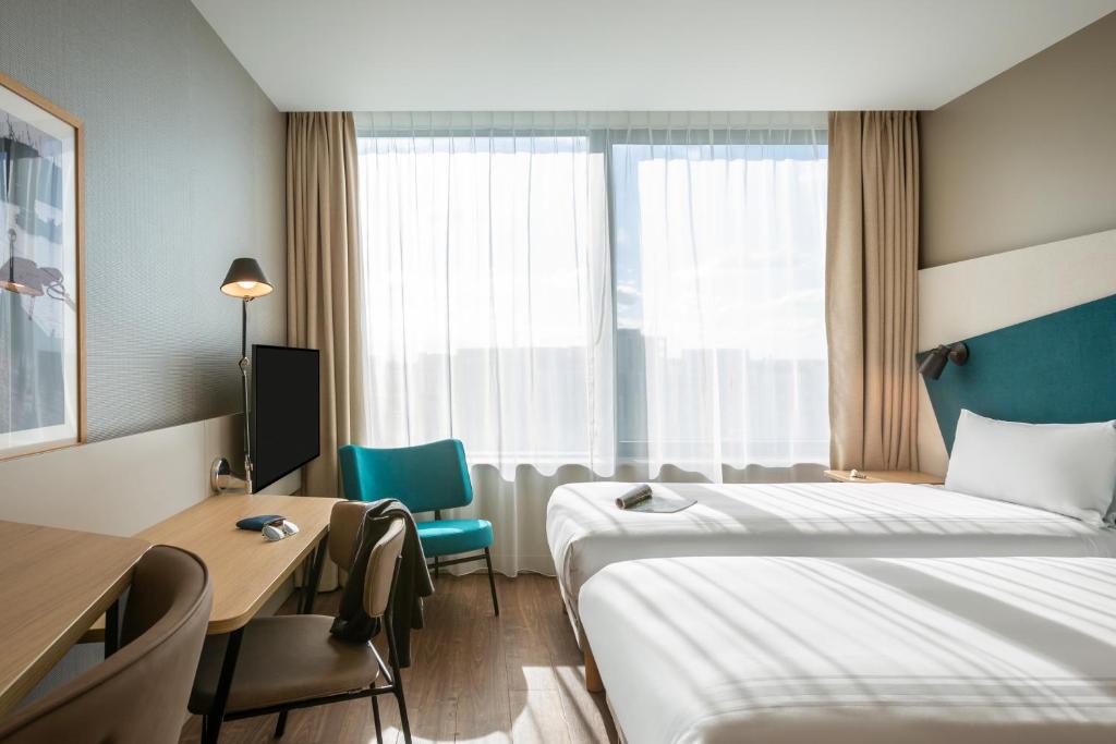 Postel nebo postele na pokoji v ubytování Aparthotel Adagio London Stratford