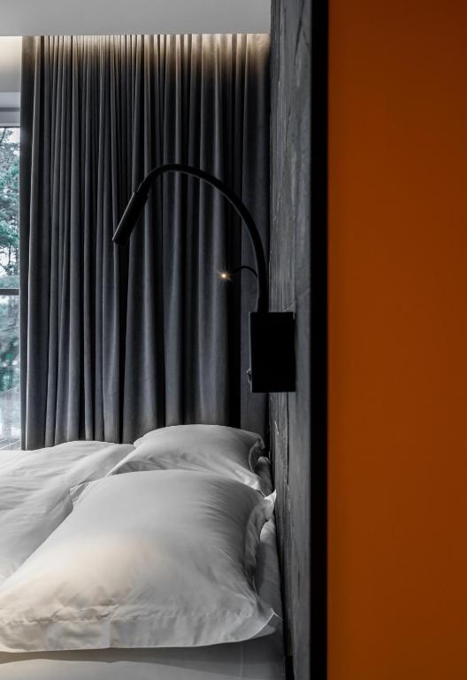 Postel nebo postele na pokoji v ubytování ESE HOTEL