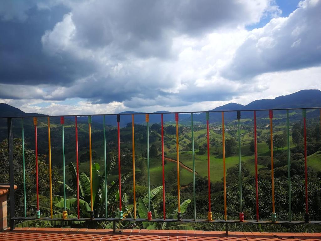 a view of a valley through a fence at Hotel Villa Palosanto in Jericó