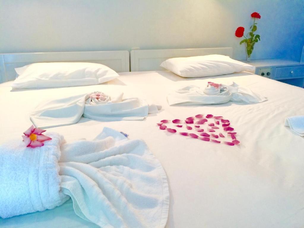 Postel nebo postele na pokoji v ubytování Hotel Kleopatra