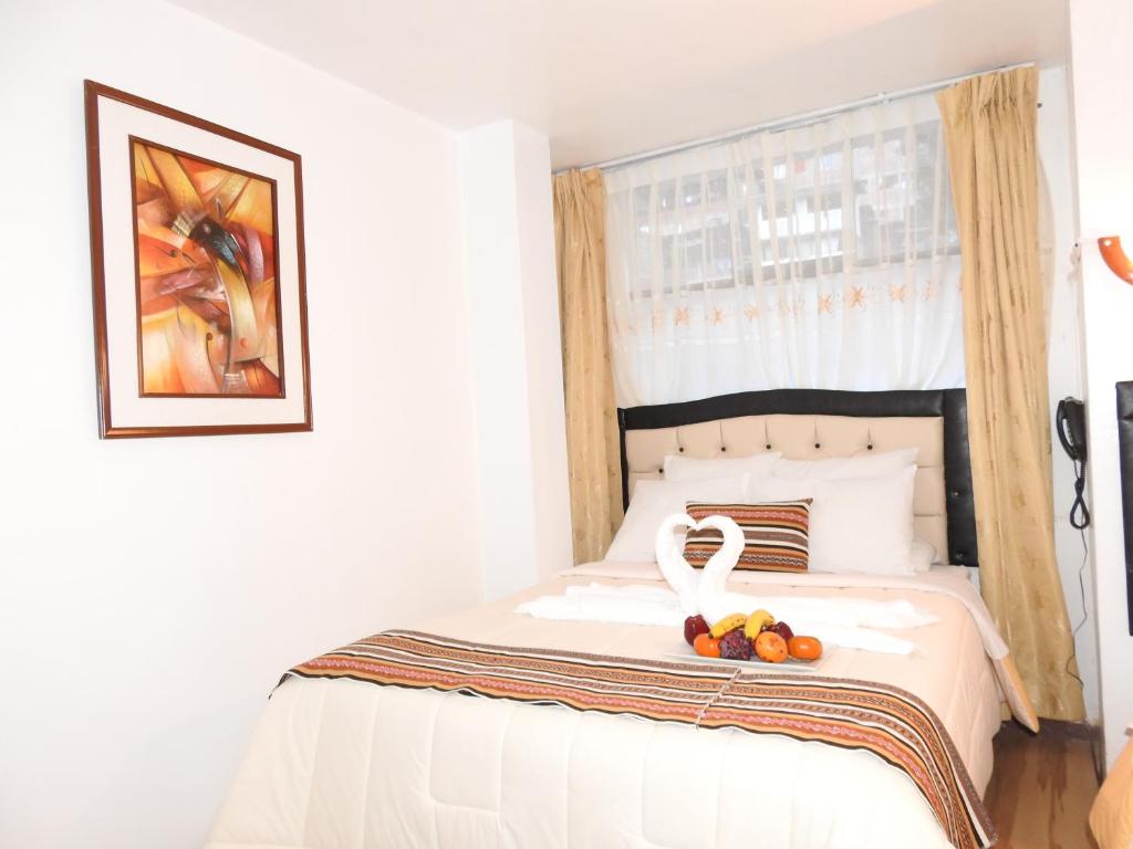 Postel nebo postele na pokoji v ubytování Hostal Encanto Machupicchu