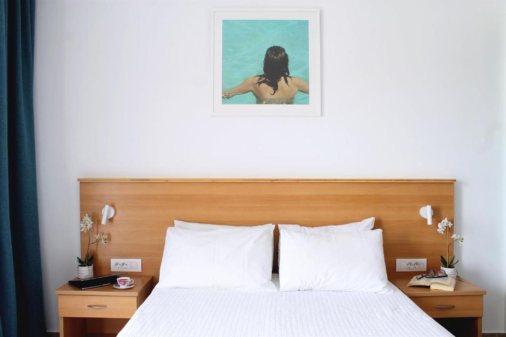 Postel nebo postele na pokoji v ubytování Paspalis Hotel