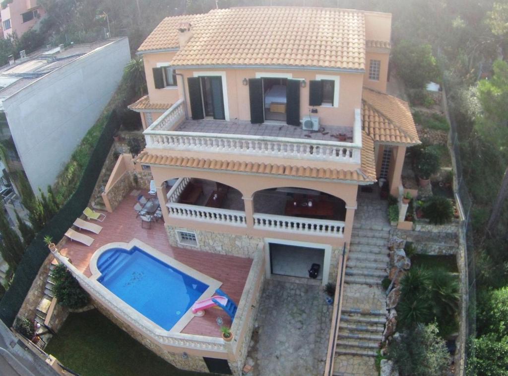 an aerial view of a house with a swimming pool at Ca Nostra · Mediterranean Villa in Majorca in Cas Català