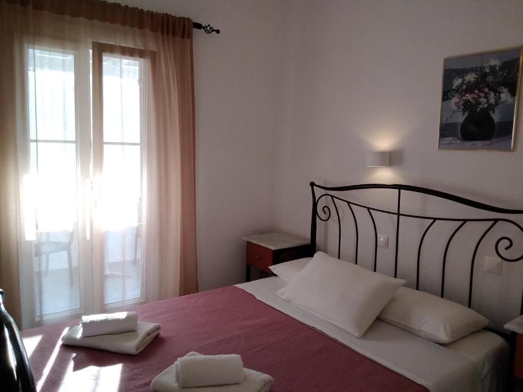 Postel nebo postele na pokoji v ubytování Asteri Hotel