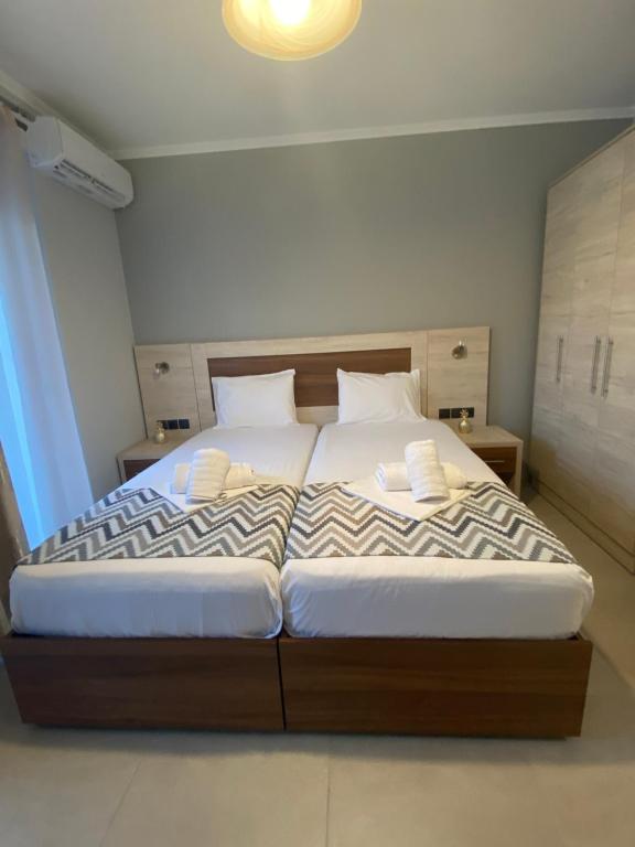 Posteľ alebo postele v izbe v ubytovaní Michaelangelo Apartments
