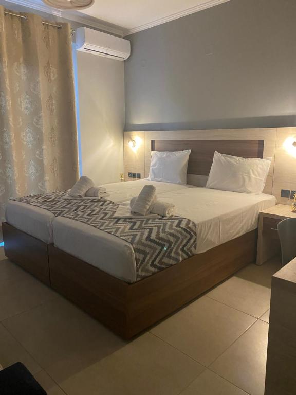 Posteľ alebo postele v izbe v ubytovaní Michaelangelo Apartments
