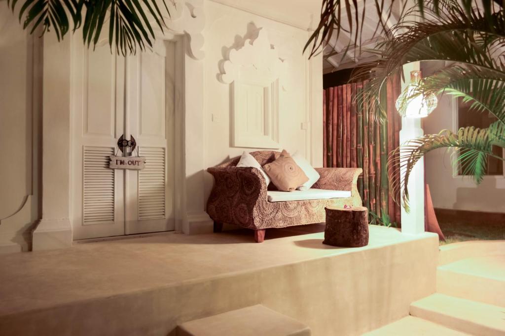 a living room with a chair and a table at Sal Secret Spot in Uluwatu