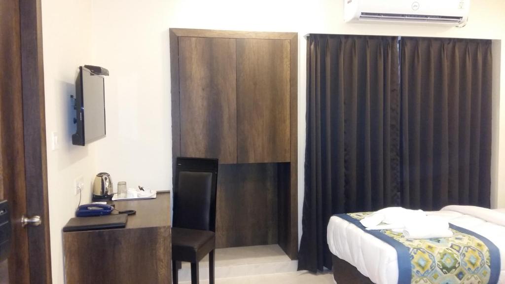 Postel nebo postele na pokoji v ubytování Hotel Mount View, Siliguri