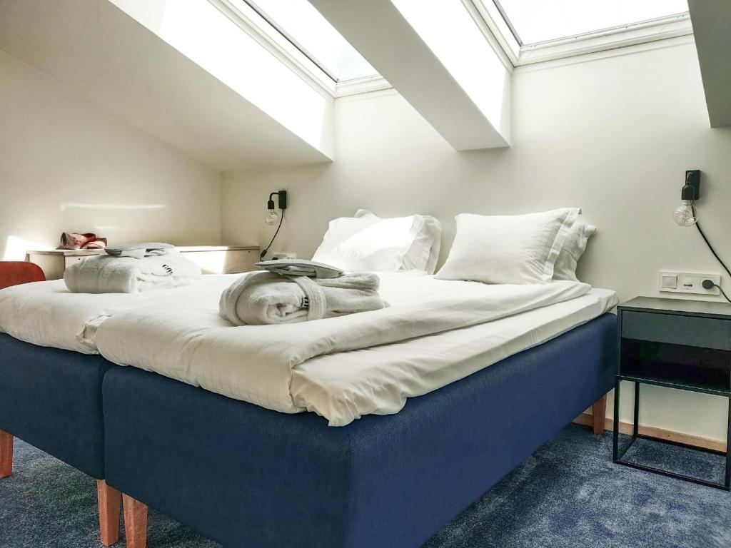 Postel nebo postele na pokoji v ubytování Staffanstorps Gästis Hotell