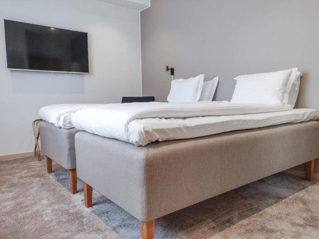 Postel nebo postele na pokoji v ubytování Staffanstorps Gästis Hotell