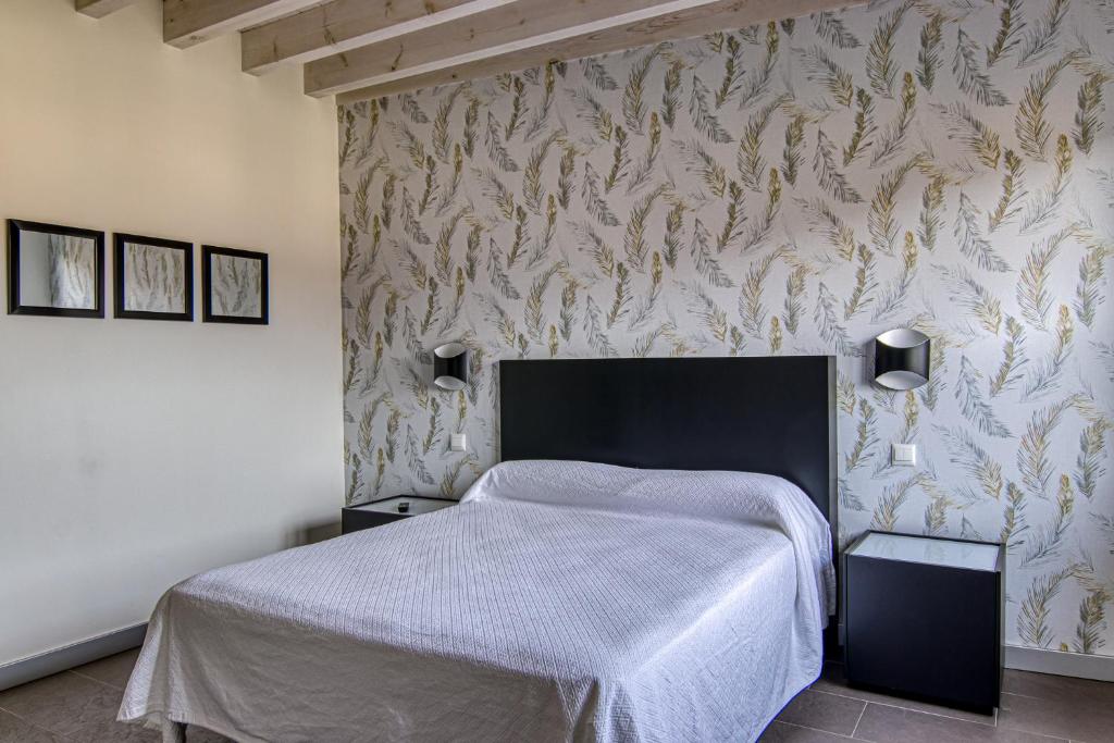 Postel nebo postele na pokoji v ubytování Apartamentos Cuatro Aguas