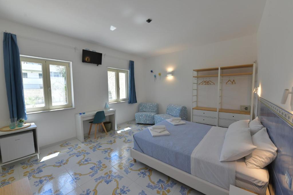 Postel nebo postele na pokoji v ubytování Acquadamare B&B