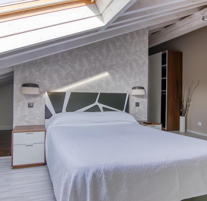 Postel nebo postele na pokoji v ubytování Apartamentos Cuatro Aguas