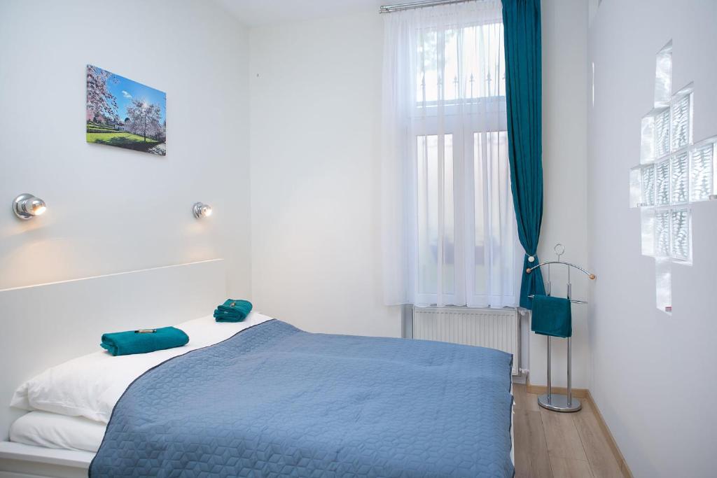 Posteľ alebo postele v izbe v ubytovaní Forrás Apartman