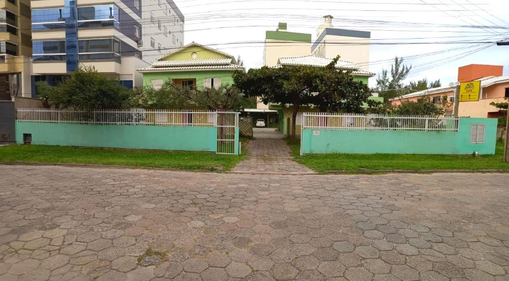 a house with a fence in front of it at ApartLaguna in Laguna