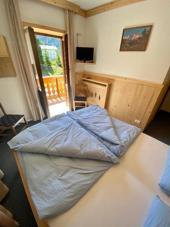 Postel nebo postele na pokoji v ubytování Garni al Barance