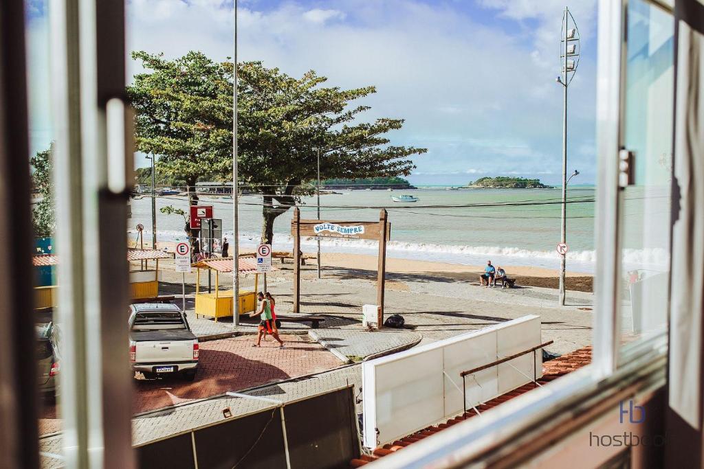 a view of a beach from a train window at Apto a beira mar no Centro - WIFI 200MB - TV Smart - Cozinha equipada - Portaria 24h - Ar condicionado in Rio das Ostras