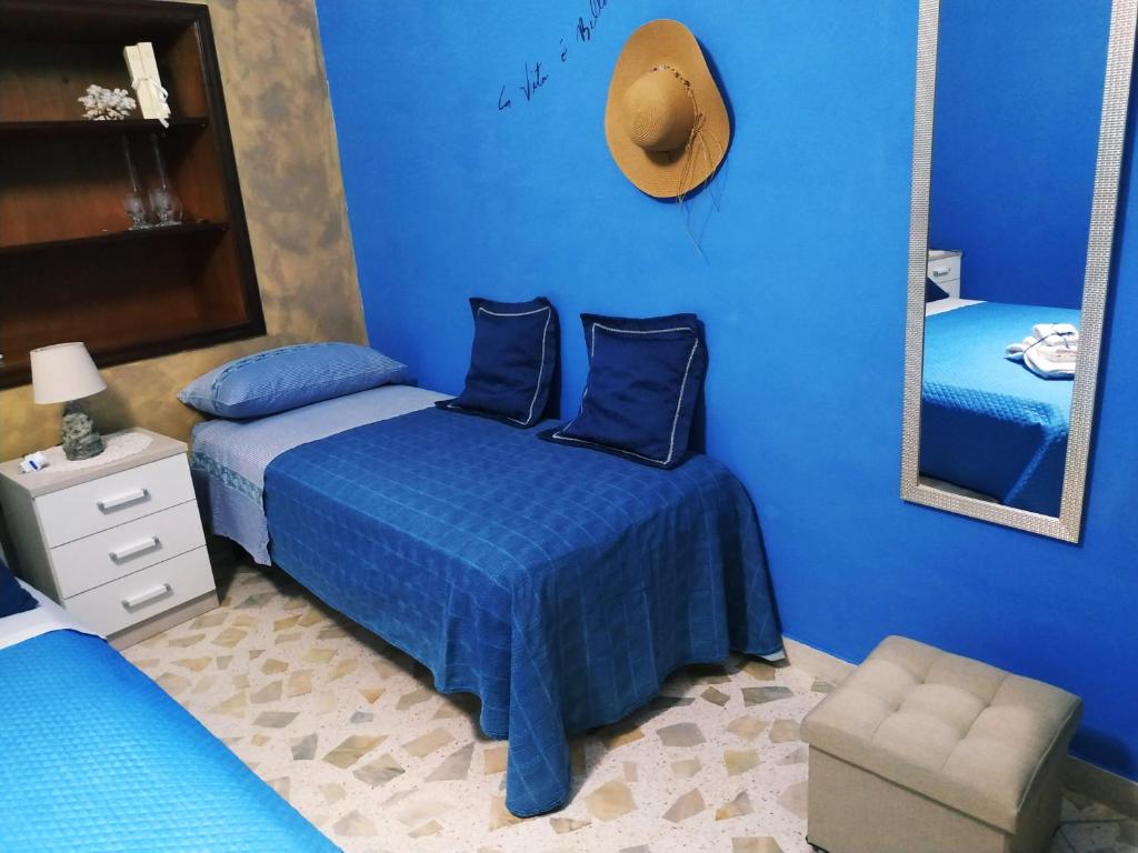 Un pat sau paturi într-o cameră la Le Lamie