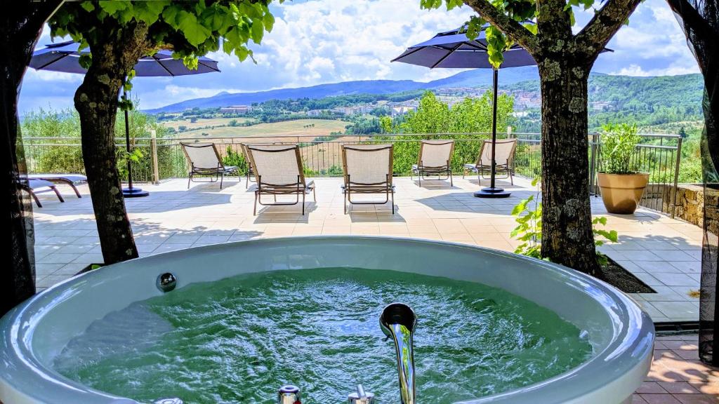 a bath tub with water coming out of it at Arts Club Boutique Hotel & Spa in Chianciano Terme