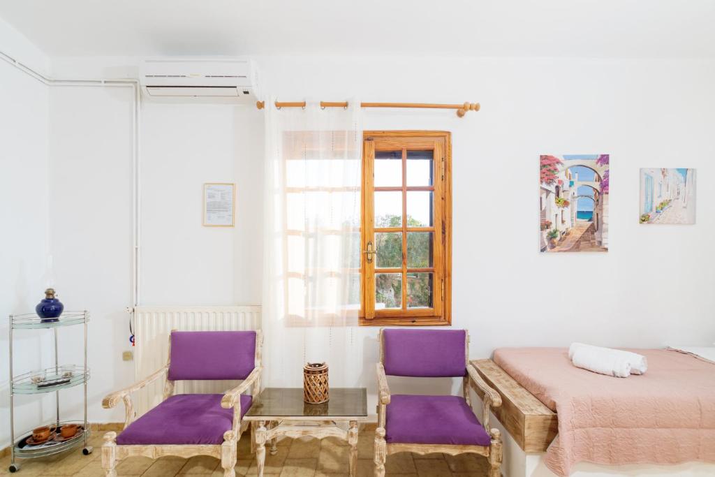 Postel nebo postele na pokoji v ubytování Romanza Villas