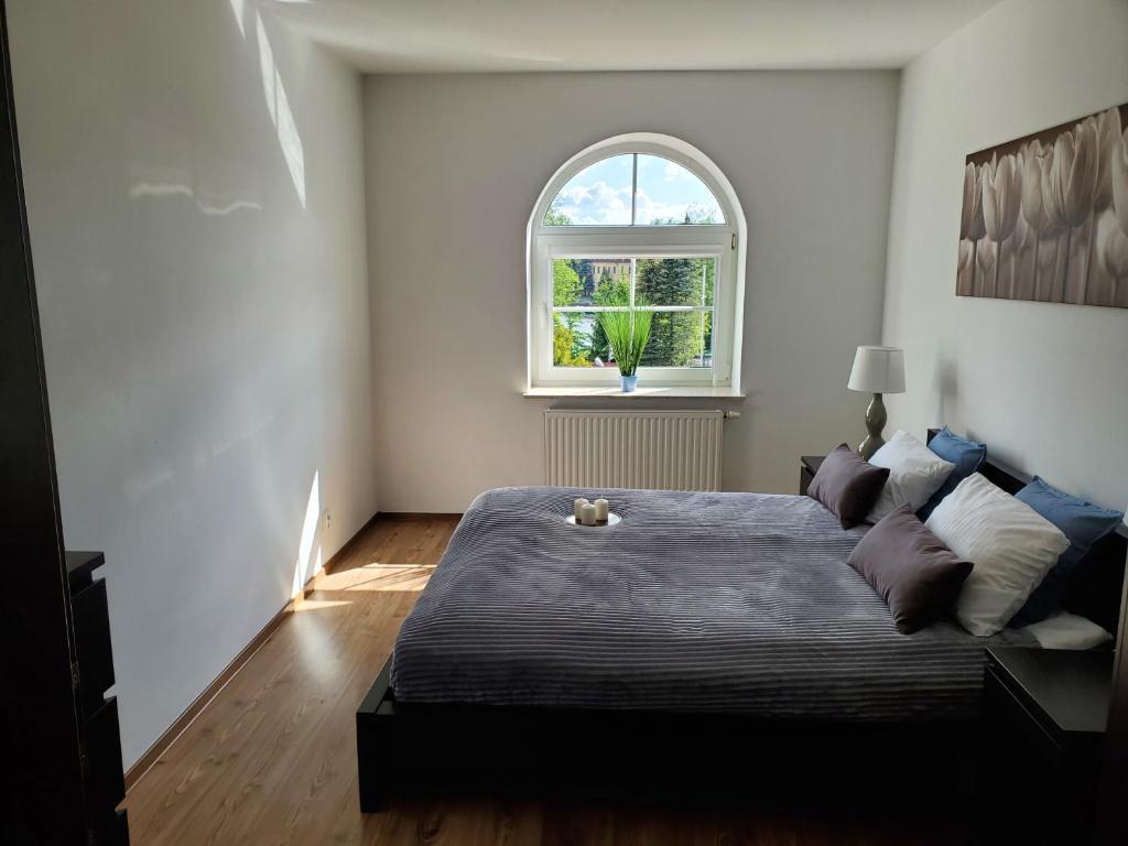 Posteľ alebo postele v izbe v ubytovaní Apartament Węgorzewo przy porcie
