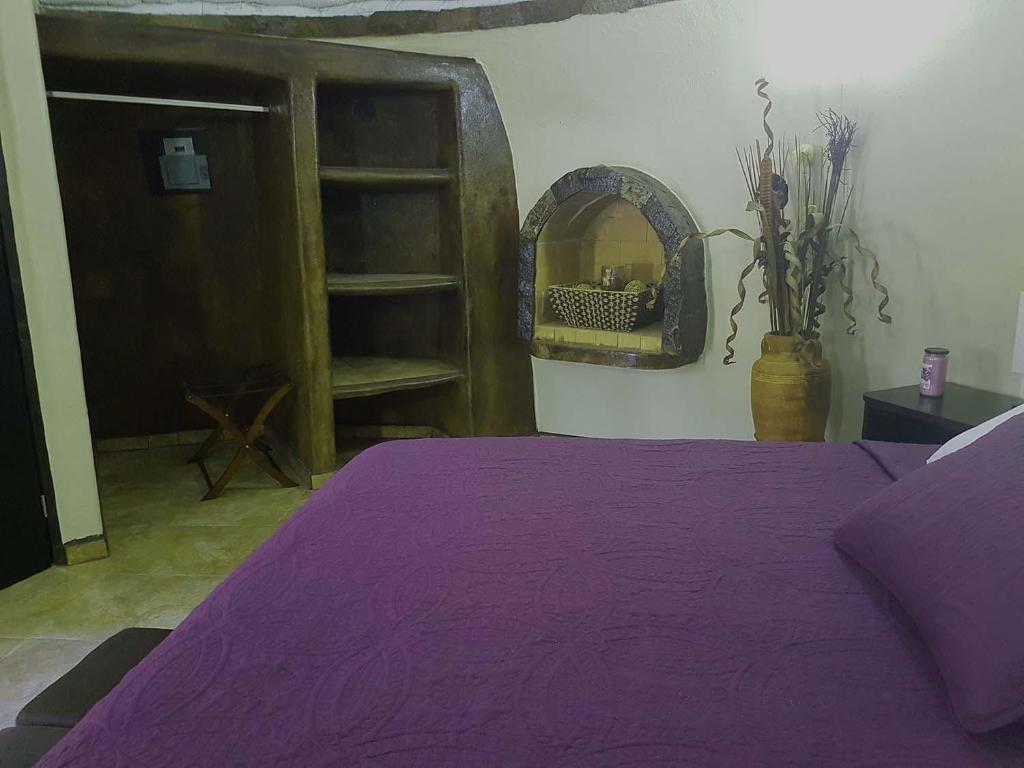 Postel nebo postele na pokoji v ubytování Hacienda Eco-Domes