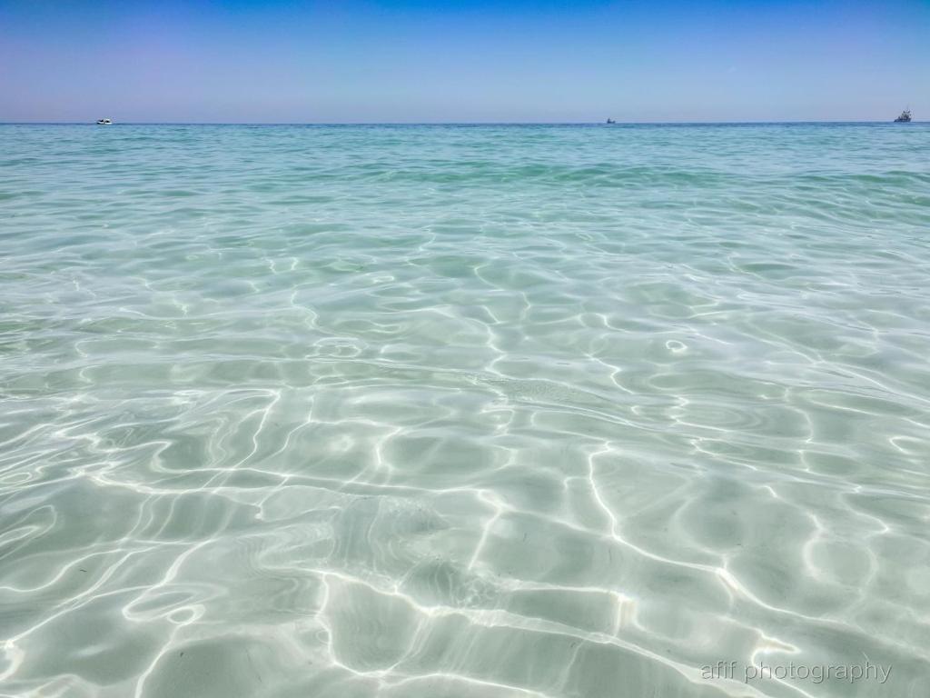 a large body of water with ripples in it at Alcasar Beach 3 rooms apartment in Sousse