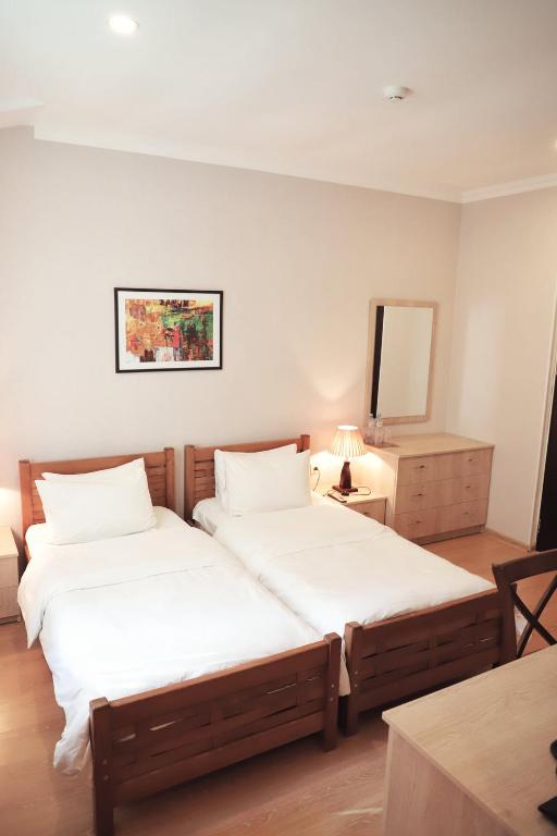 Postel nebo postele na pokoji v ubytování Abastumani Residence