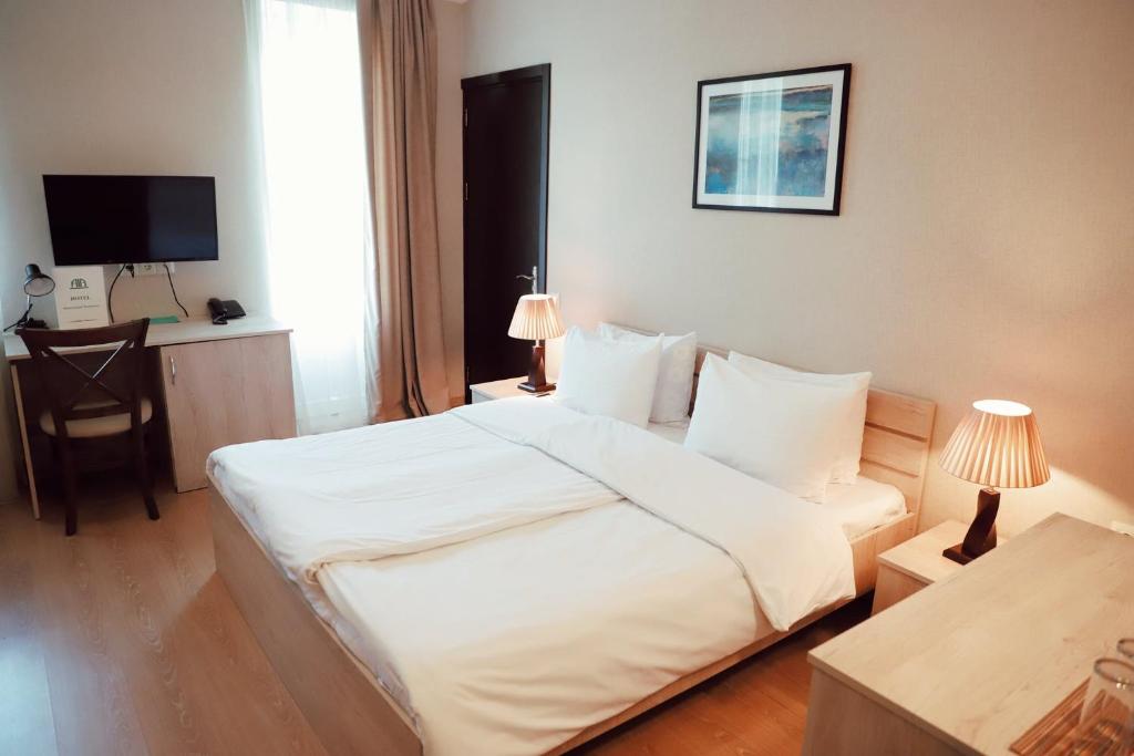 Postel nebo postele na pokoji v ubytování Abastumani Residence