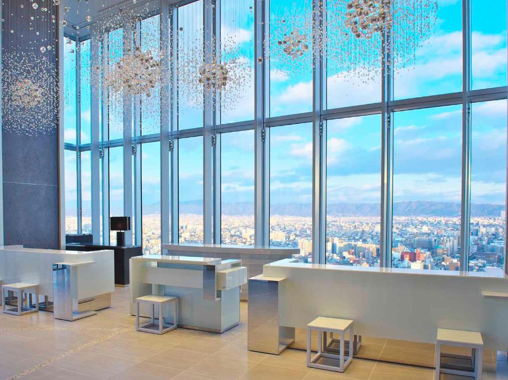 a room with a large window with chandeliers at Osaka Marriott Miyako Hotel in Osaka