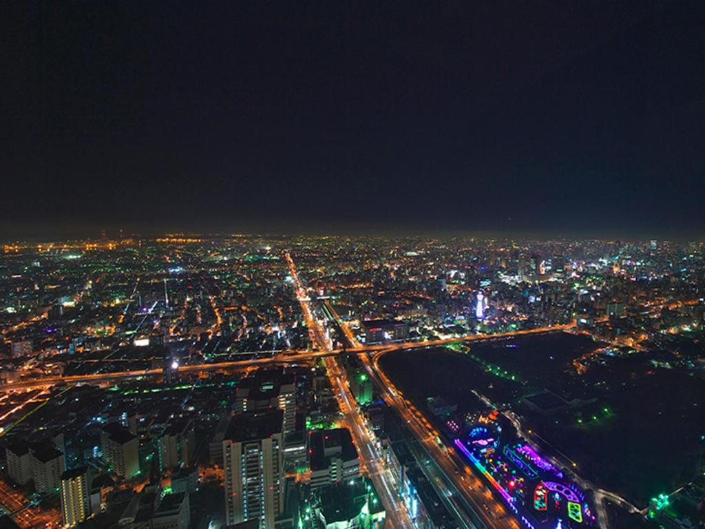 an aerial view of a city at night at Osaka Marriott Miyako Hotel in Osaka