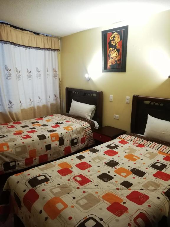 Postel nebo postele na pokoji v ubytování Hotel Navarra